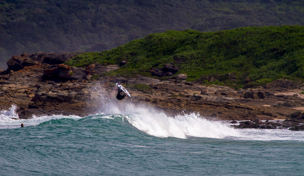 Michael Monk flipping out, just the other side that hill is another bay for another day. Photo by: Tyerell Jordaan