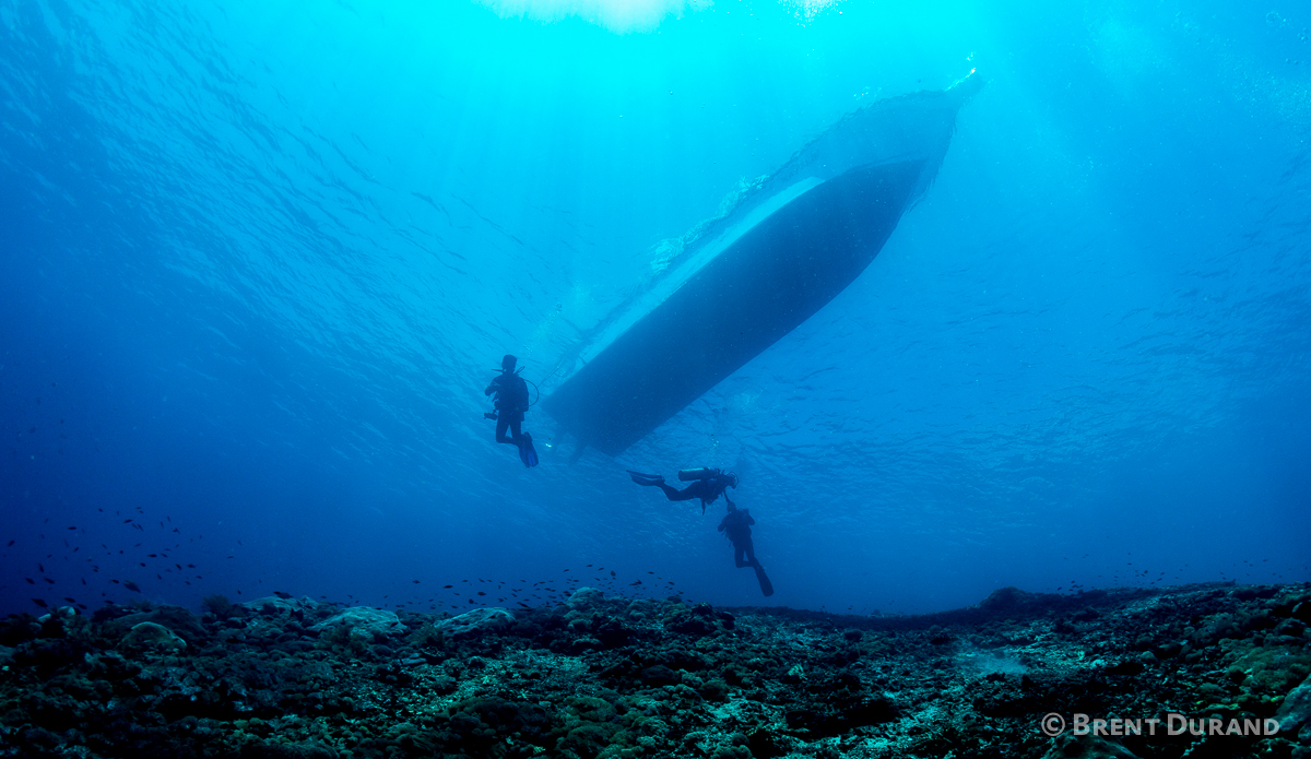 Scuba divers descend to check out a remote Indonesian reef. Photo: <a href=\"http://www.brentdimagery.com/\"> Brent Durand</a>