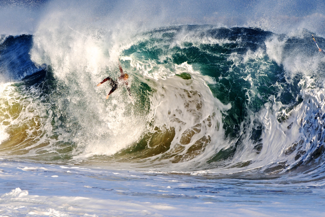 Spencer Pirdy freefalls from the lip of a heavy shore breaking wave at Wedge. Photo: Benjamin Ginsberg / Driftwood Photography Studios