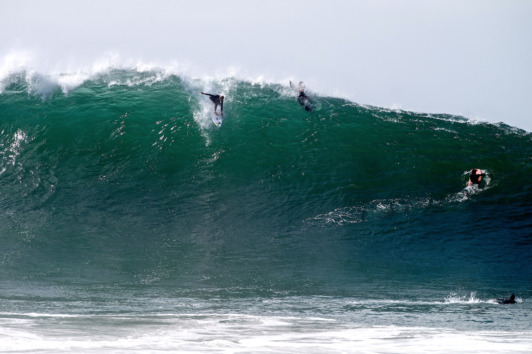 On the biggest days of the summer you\'ll find Bobby Okvist in the best position to make critical drops like this at Wedge. Photo: Benjamin Ginsberg / Driftwood Photography Studios