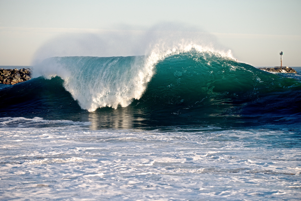 At times Wedge might look like a beautiful A-Frame...just be sure you go left; the jetty has taken lives in the past. Photo: Benjamin Ginsberg / Driftwood Photography Studios