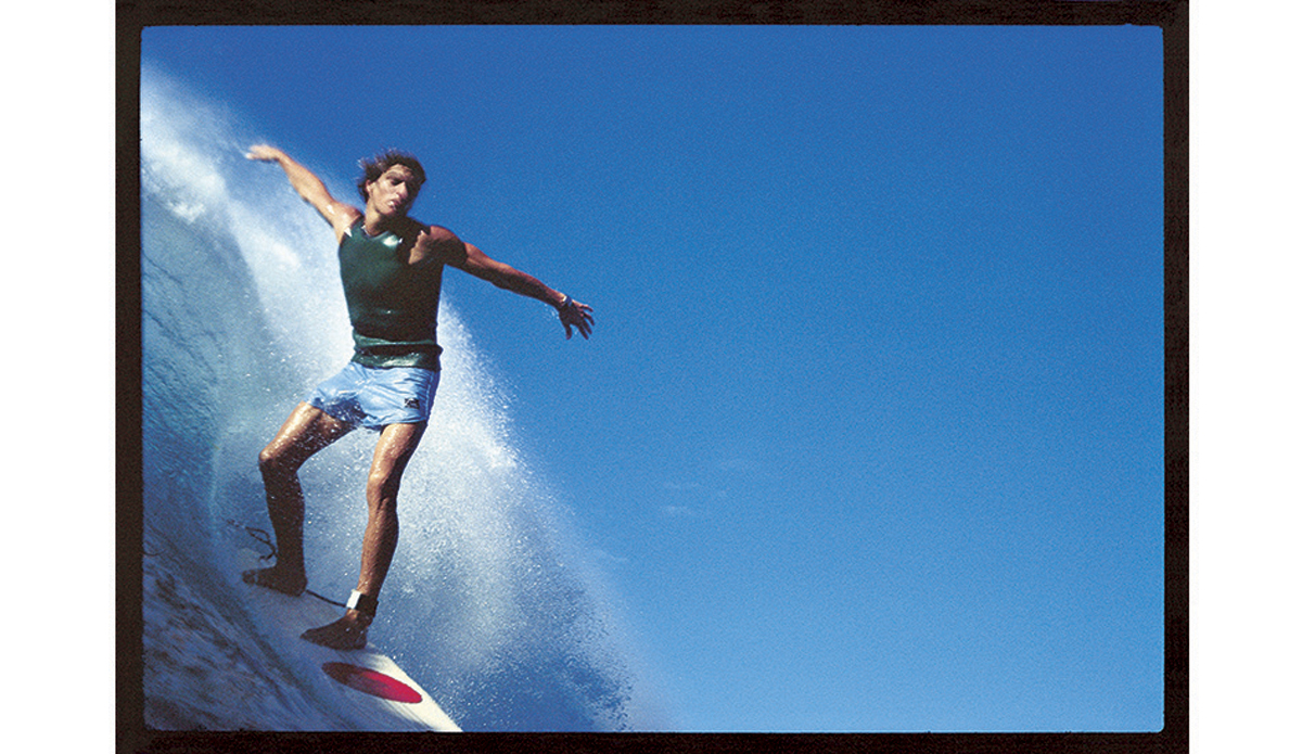 Buzzy Kerbox at Haleiwa 1976
In many ways, this picture marks the end of my time as a ‘surf photographer’ (had I ever seen myself as one). I would’ve been holding the Nikonos out in my right hand as far away as possible to avoid being run over. I love the weird composition. No editor has ever seen what I do in this picture – not that I’m still bearing a grudge about that 38 years later.
 Photo: <a href=\"http://www.johnwitzig.com.au/\">John Witzig</a>