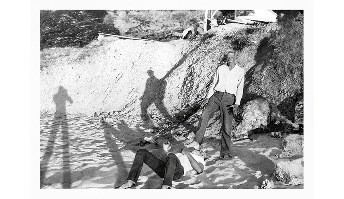 Toes on the nose c. 1962
A bunch of us were at Duranbah, just across the northern NSW border in Queensland. This was a picture taken for fun amongst friends – Nat’s big feet on Midget’s big nose. The ‘friends’ bit didn’t last.
 Photo: <a href=\"http://www.johnwitzig.com.au/\">John Witzig</a>