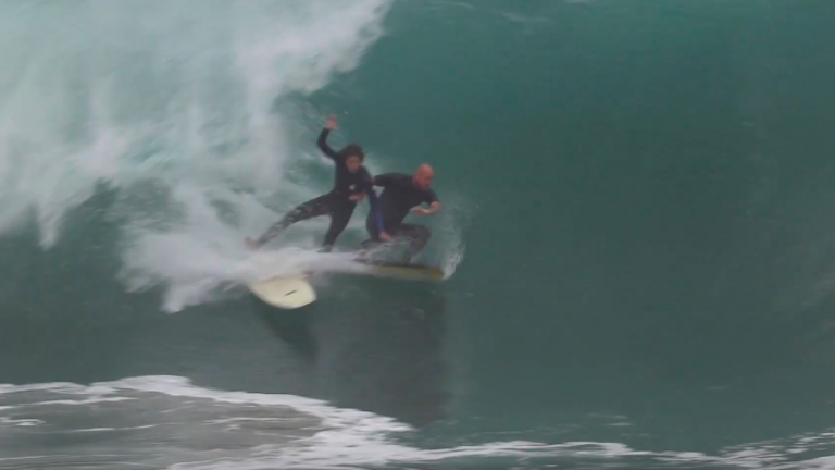 Bodyboarder versus surfer at the Wedge.