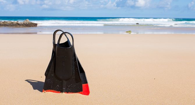 Swim fins on the beach