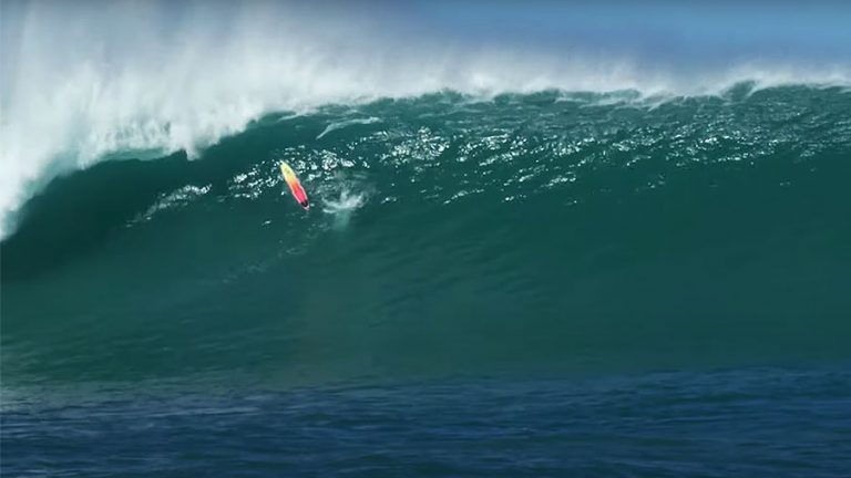 Koa Smith's surfboard going over a huge wave at Phantoms