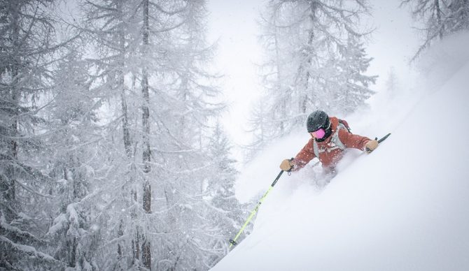 alex lange via unsplash powder skiing deep