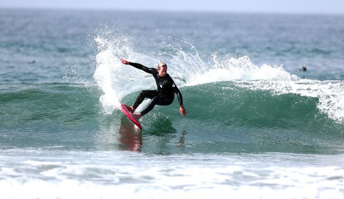 Colin McPhillips rides a wave on a Gerry Lopez board