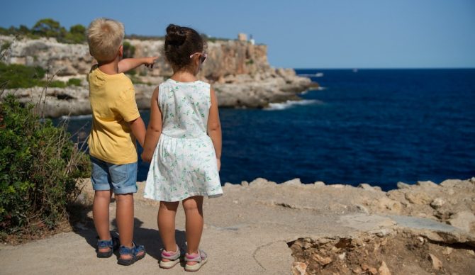 kids standing on cliff