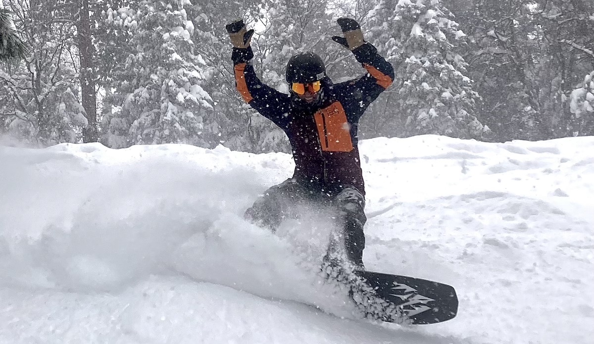 snowboarding in california with jones snowboard and burton mittens