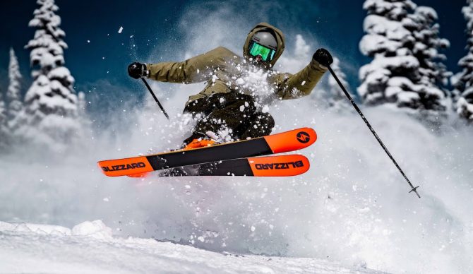 A skier hits some powder.