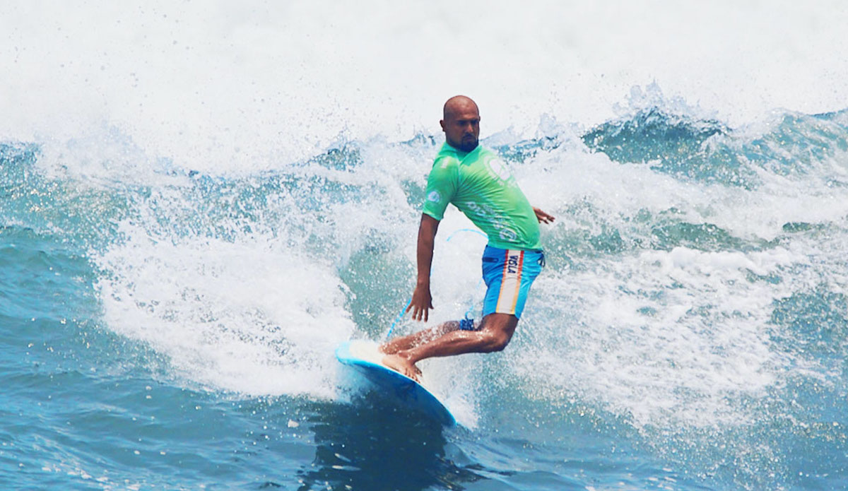 A longboarder gets funky on a wave in Surf City. (Photo/Surf City)