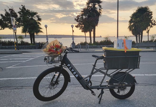 the flyer l885 cargo electric bike in action, fully loaded with gear