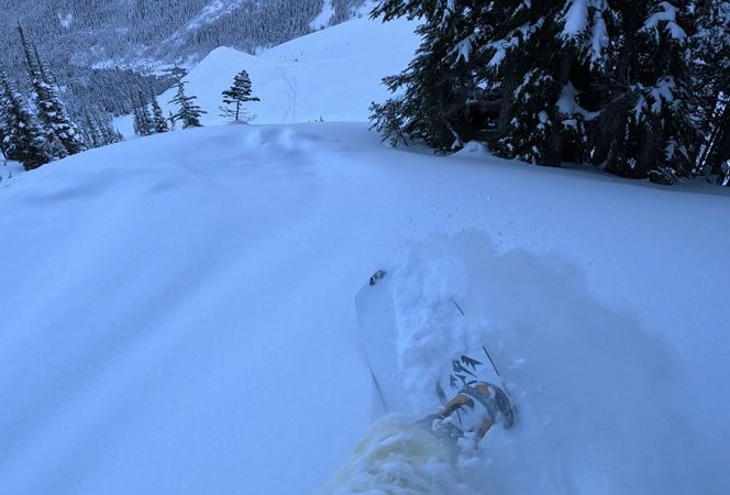 a shot of the Nitro Team TLS snowboard boots while riding in powder