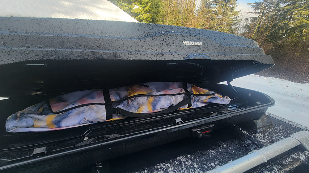 The Burton Space Sack snowboard bag inside the yakima skybox rooftop box