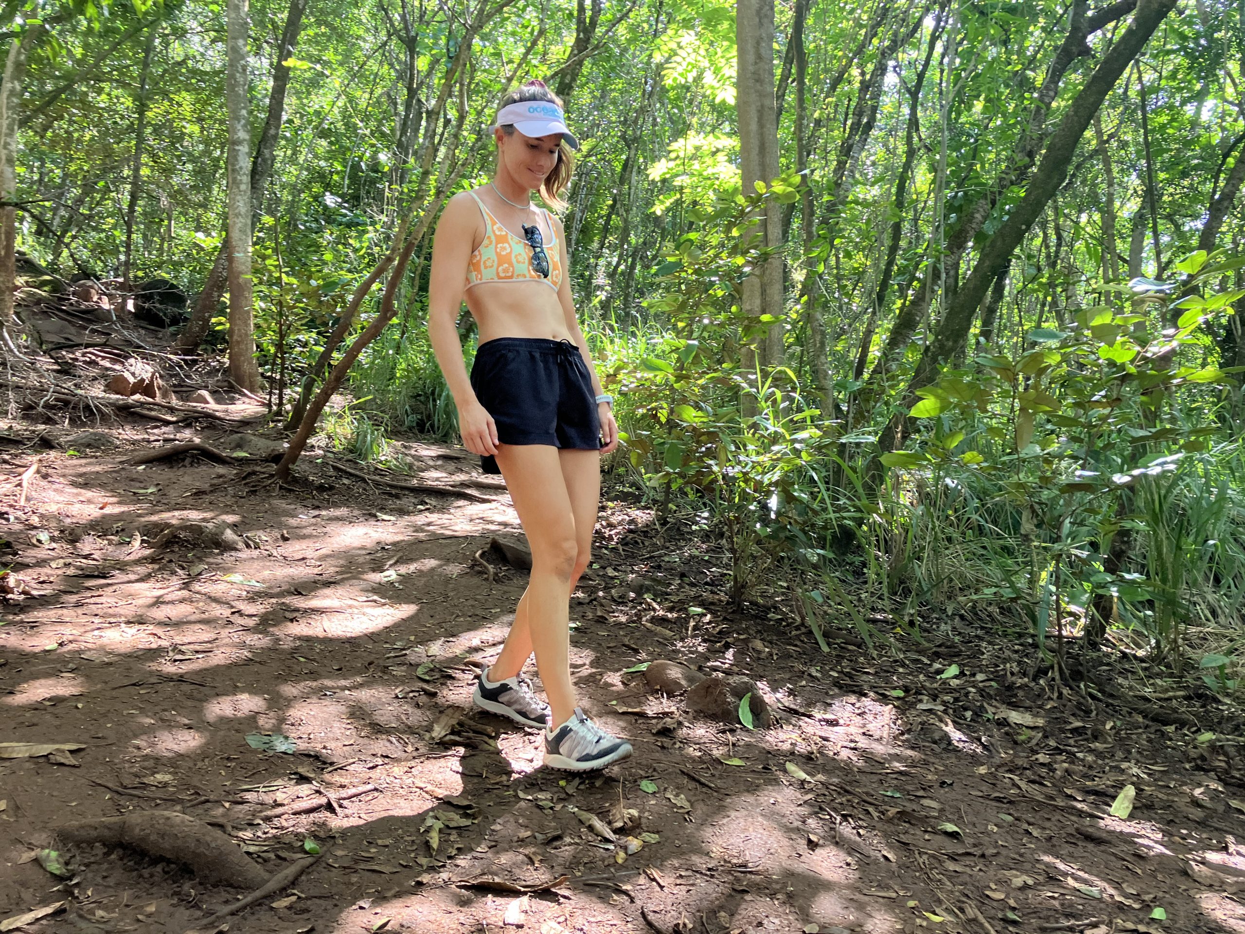 woman hiking in the forest in watershoes