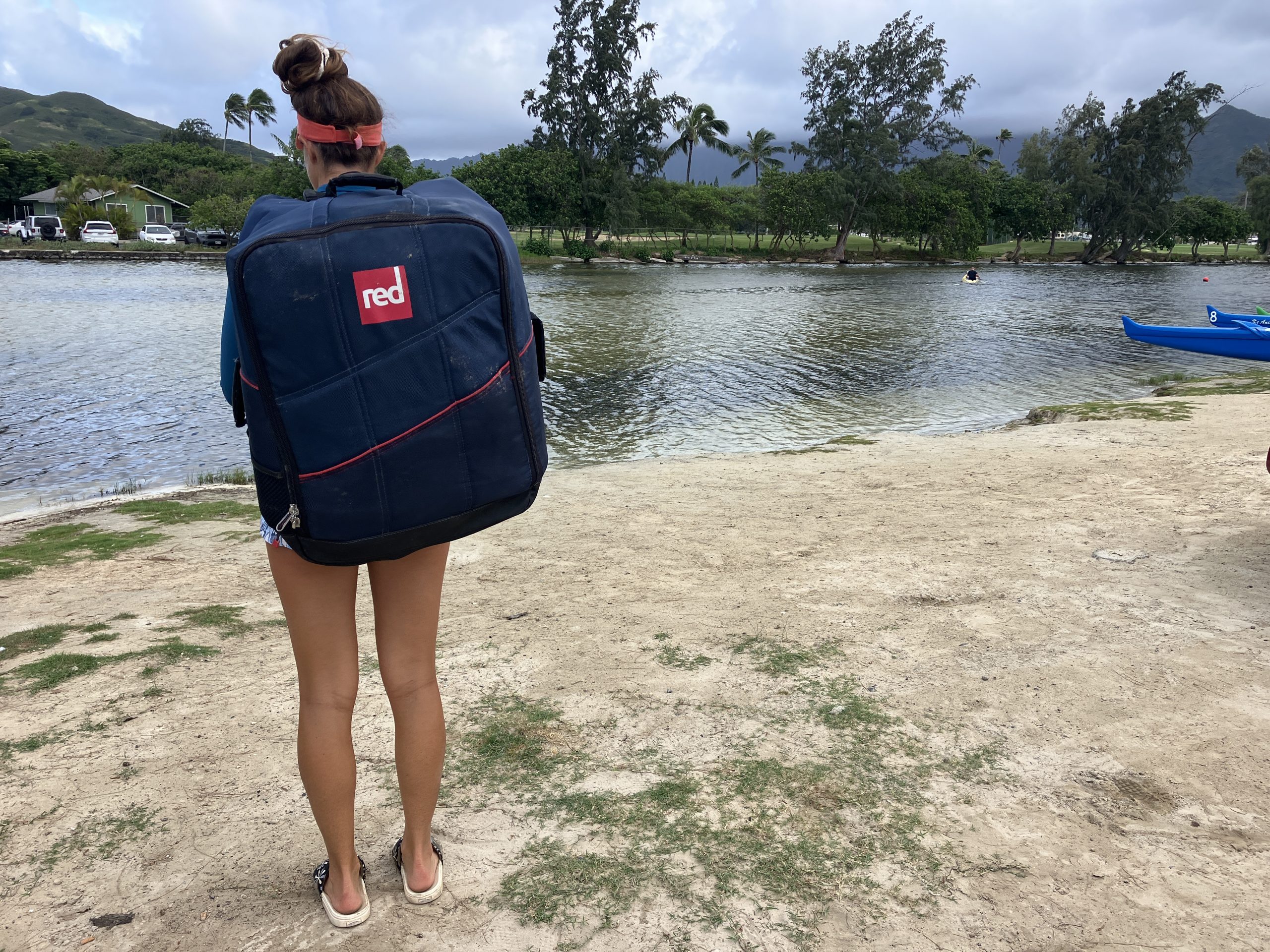 woman wearing a backpack at the water