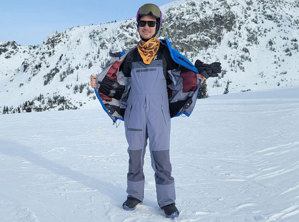 a person on a mountain modeling snowboard pants