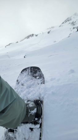 snowboarding in Whistler, BC on top of an alpine run