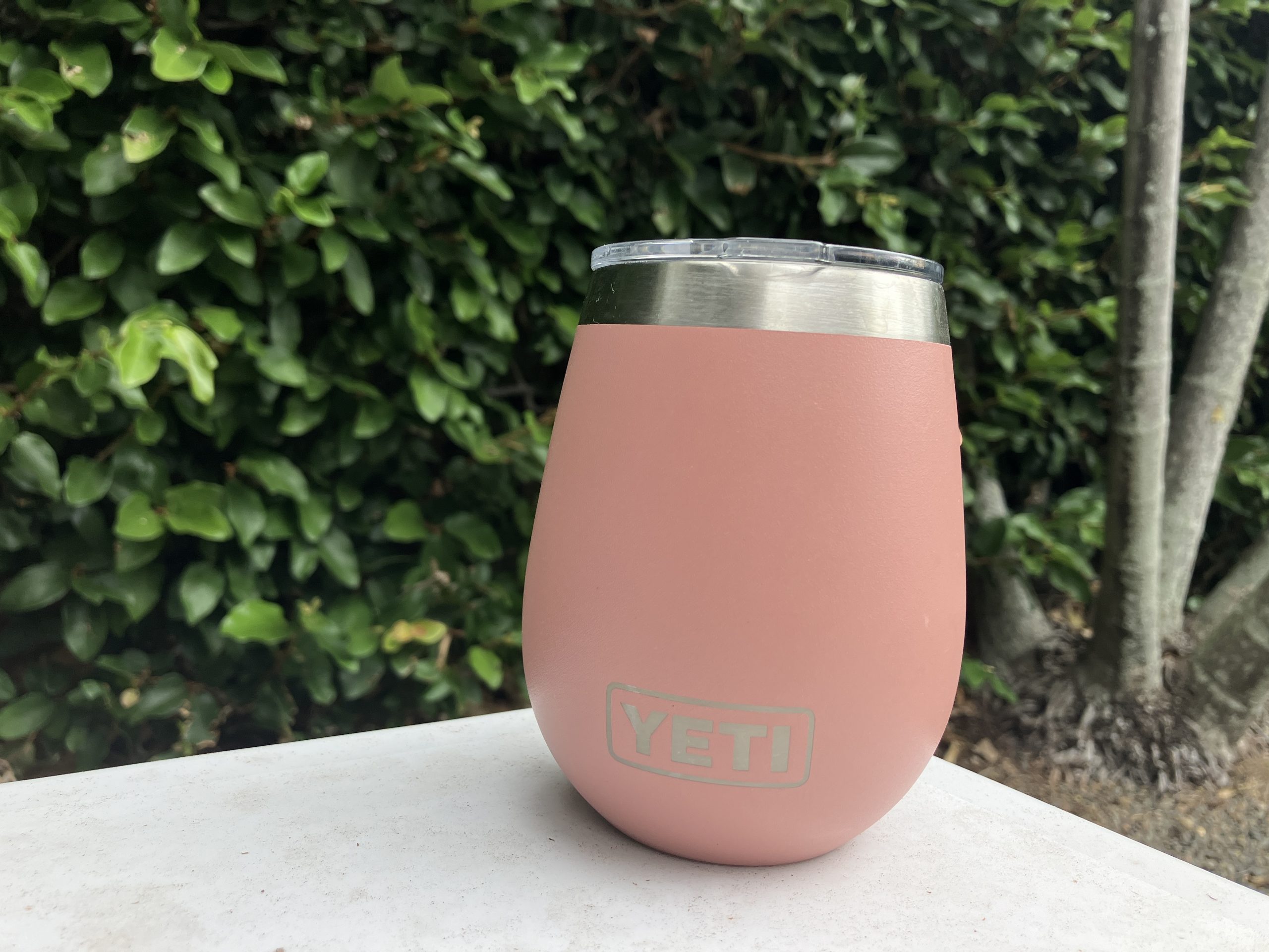 a pink YETI wine tumbler being used as an insulated coffee mug