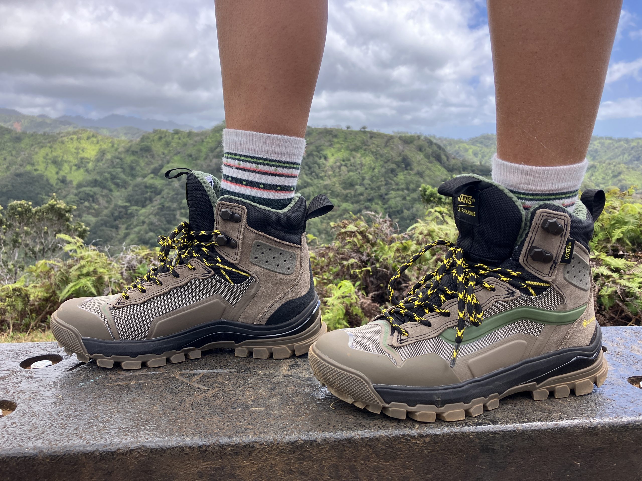 a close up of a woman wearing a pair of Vans hiking boots