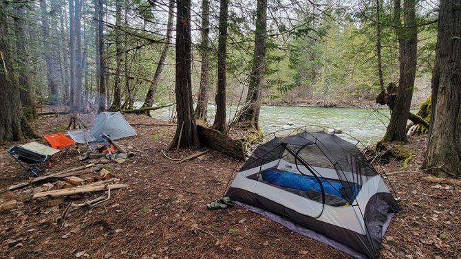 the REI Half Dome and Sea to Summit alto tr1 backpacking tents by a fire and the river