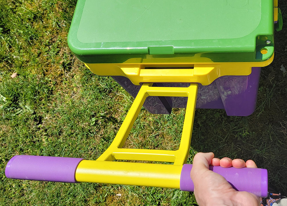 holding the handles of the RTIC ultra-light wheeled cooler