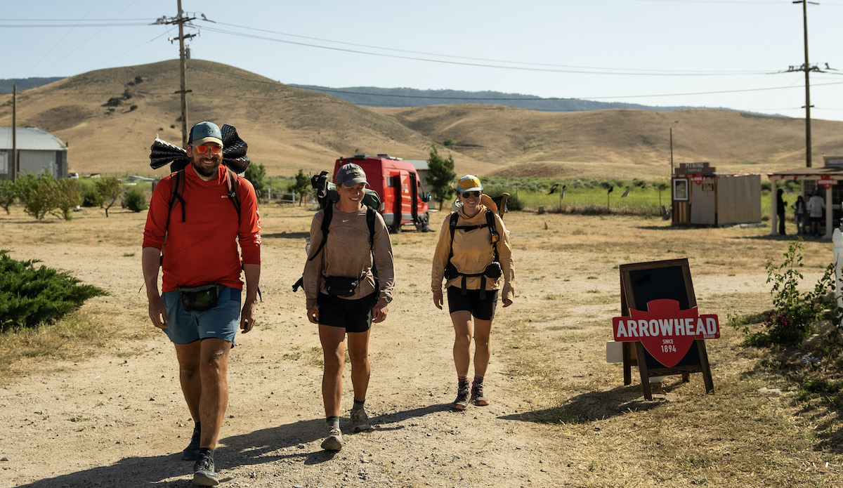 Full of smiles, PCT hikers walk into Hikertown at Mile 517. Photo: Arrowhead