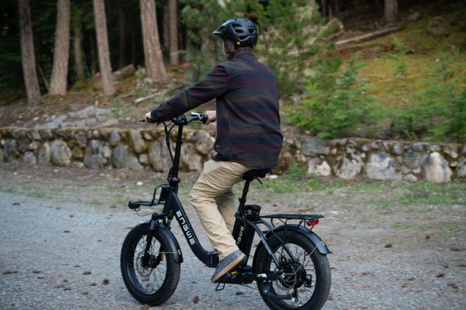 The Engwe L20 electric bike in action on a dirt road