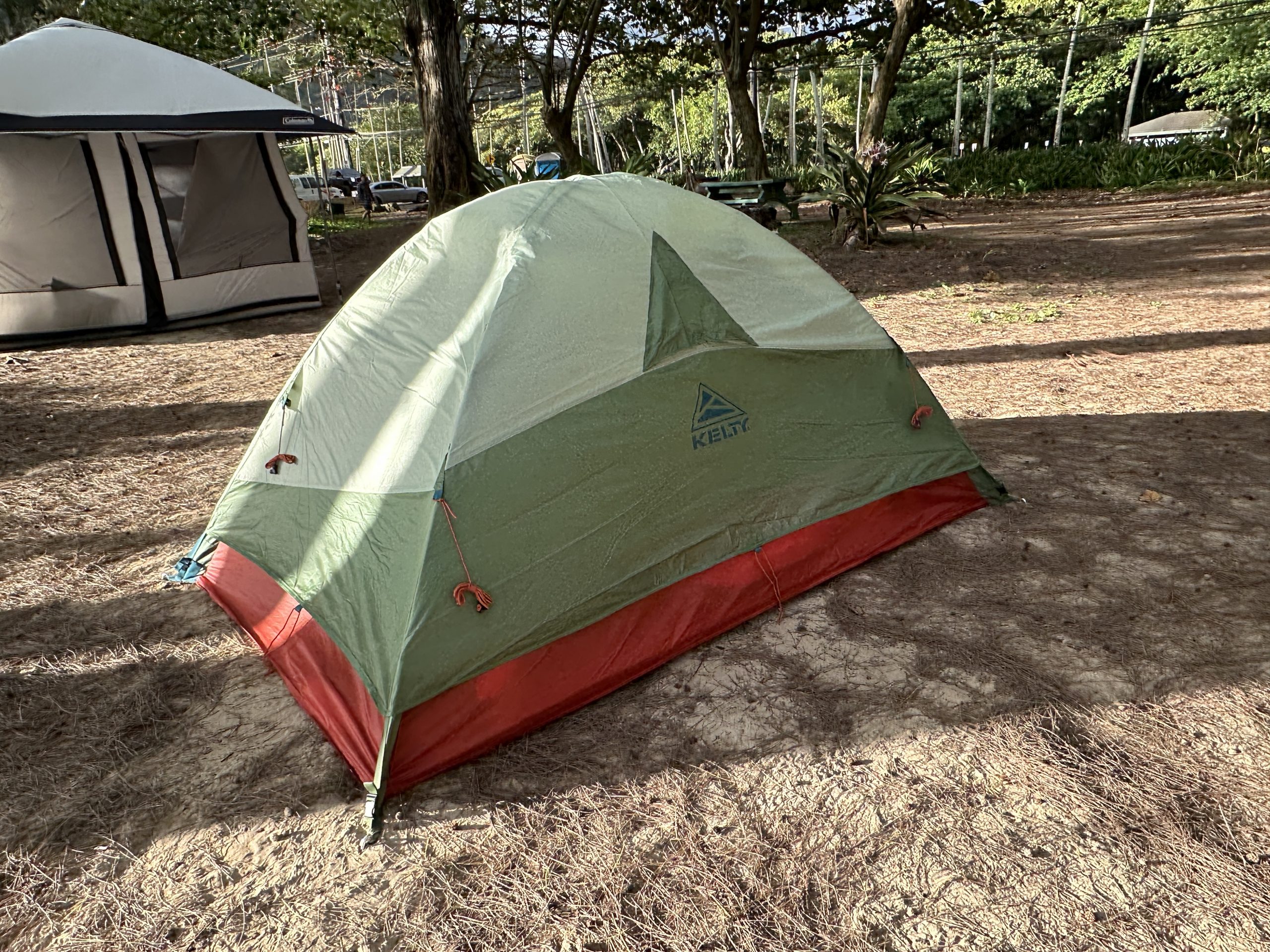 kelty tent at a campground with a rainfly