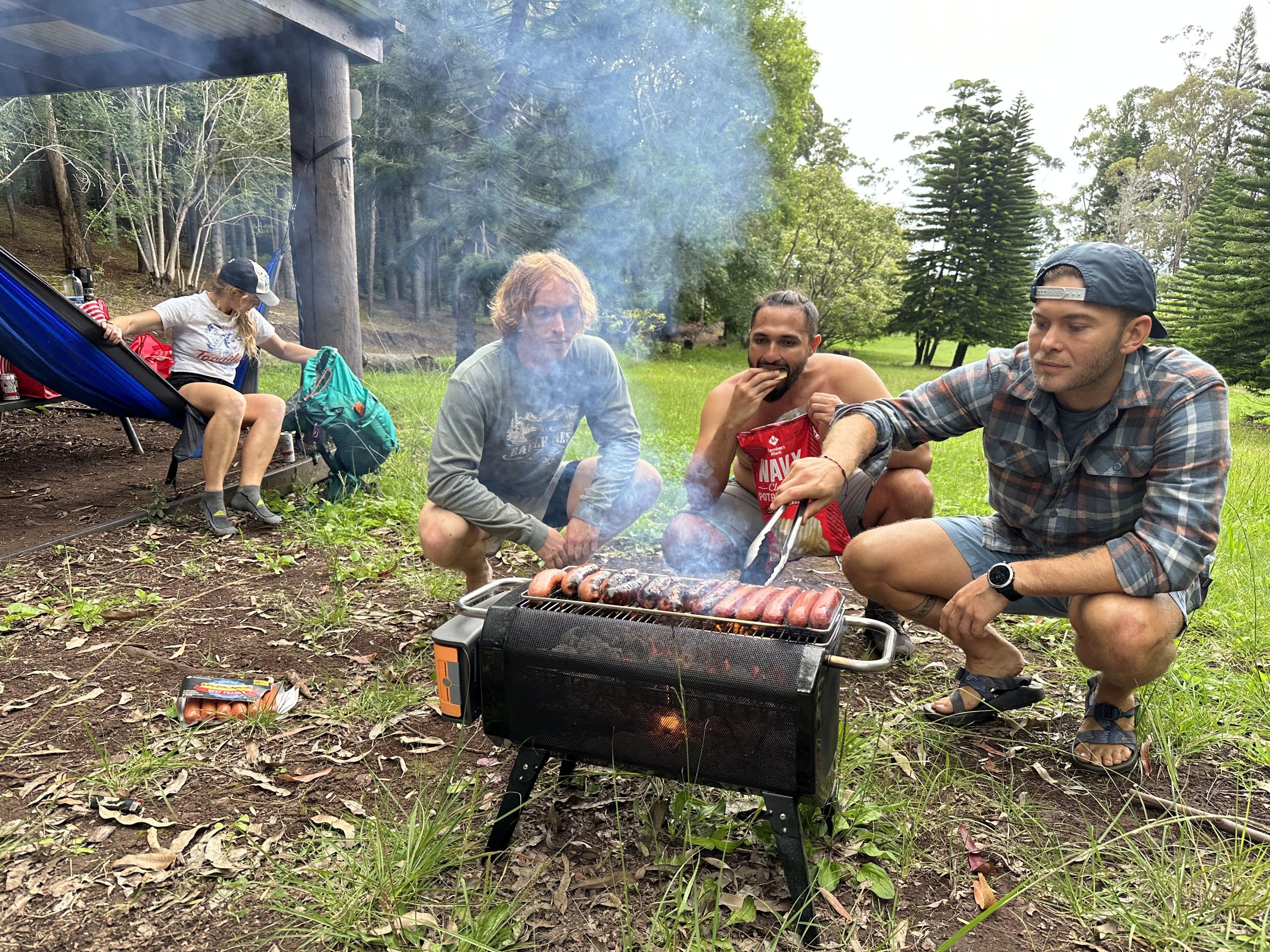 friends around a bonfire camping stove