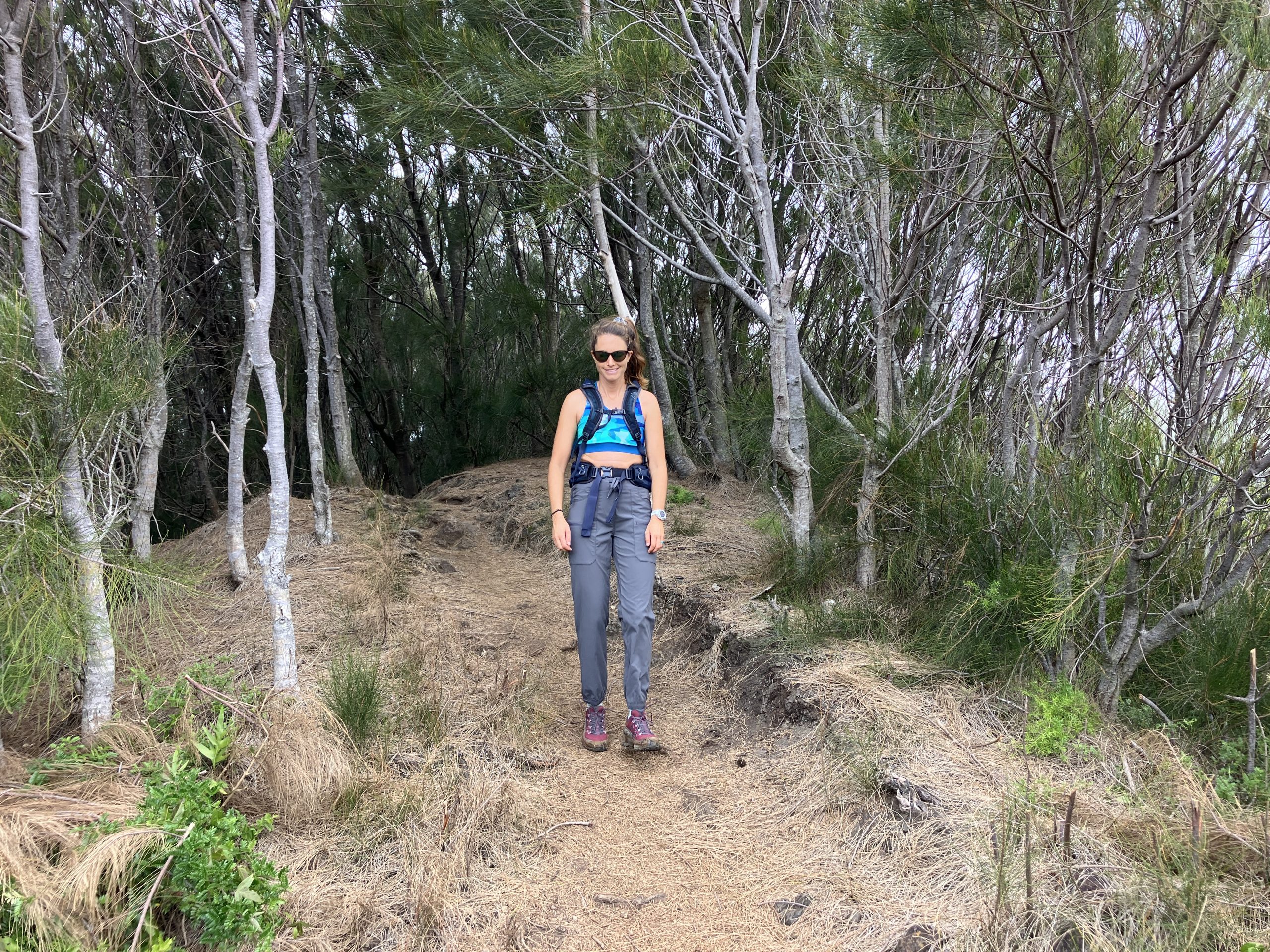 a woman hiking in hiking pants