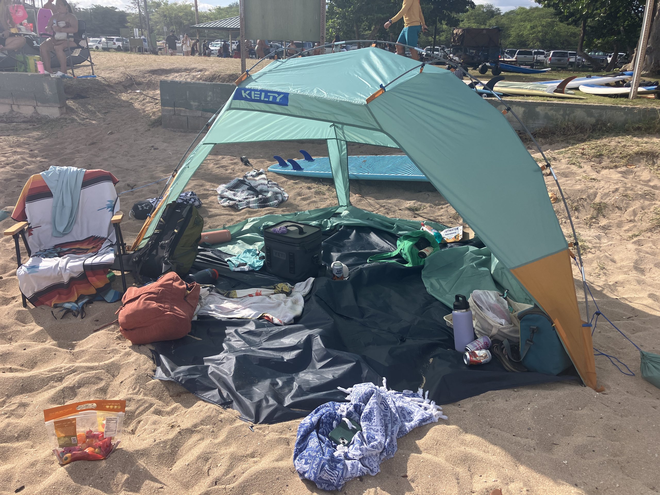 a beach canopies at the beach with lots of stuff in it