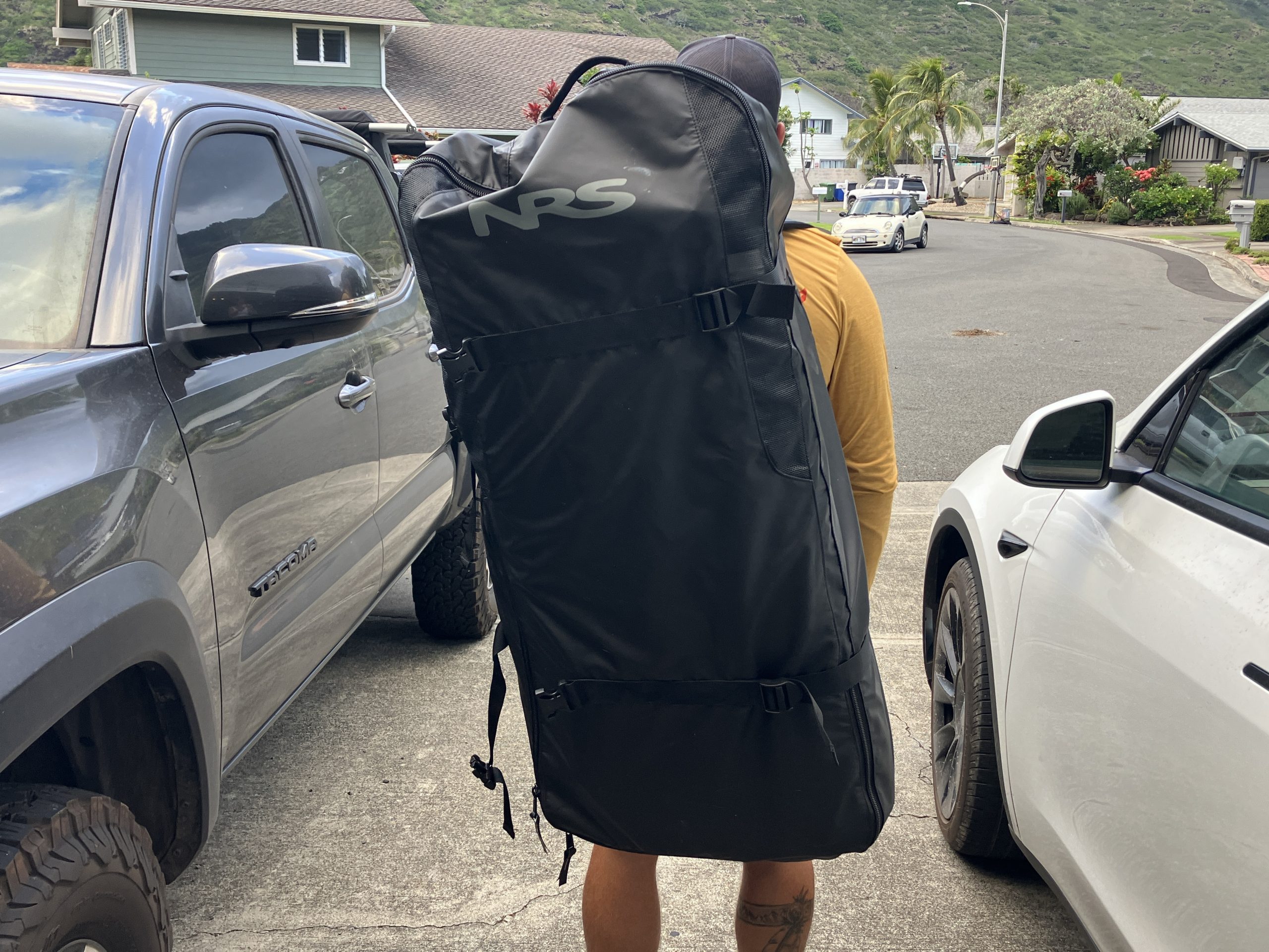 a man wearing a paddle board backpack of the NRS Jukdo