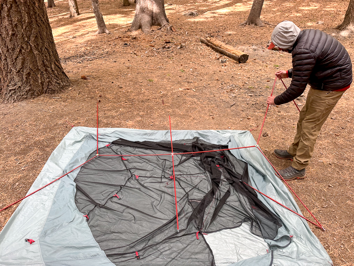 man setting up tent