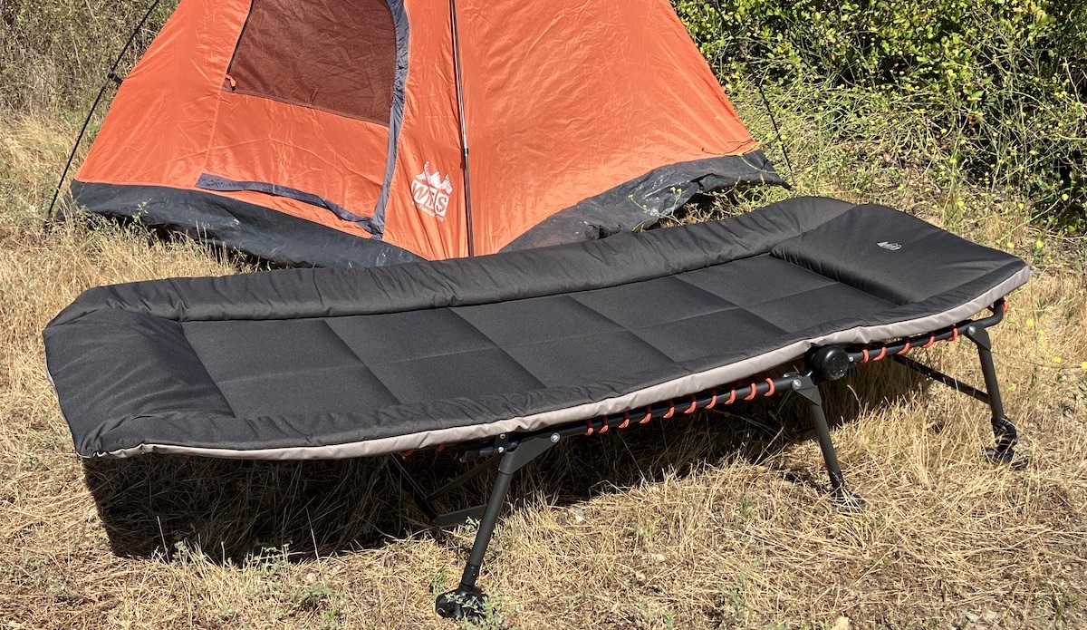 The REI Kingdom Cot in front of a tent