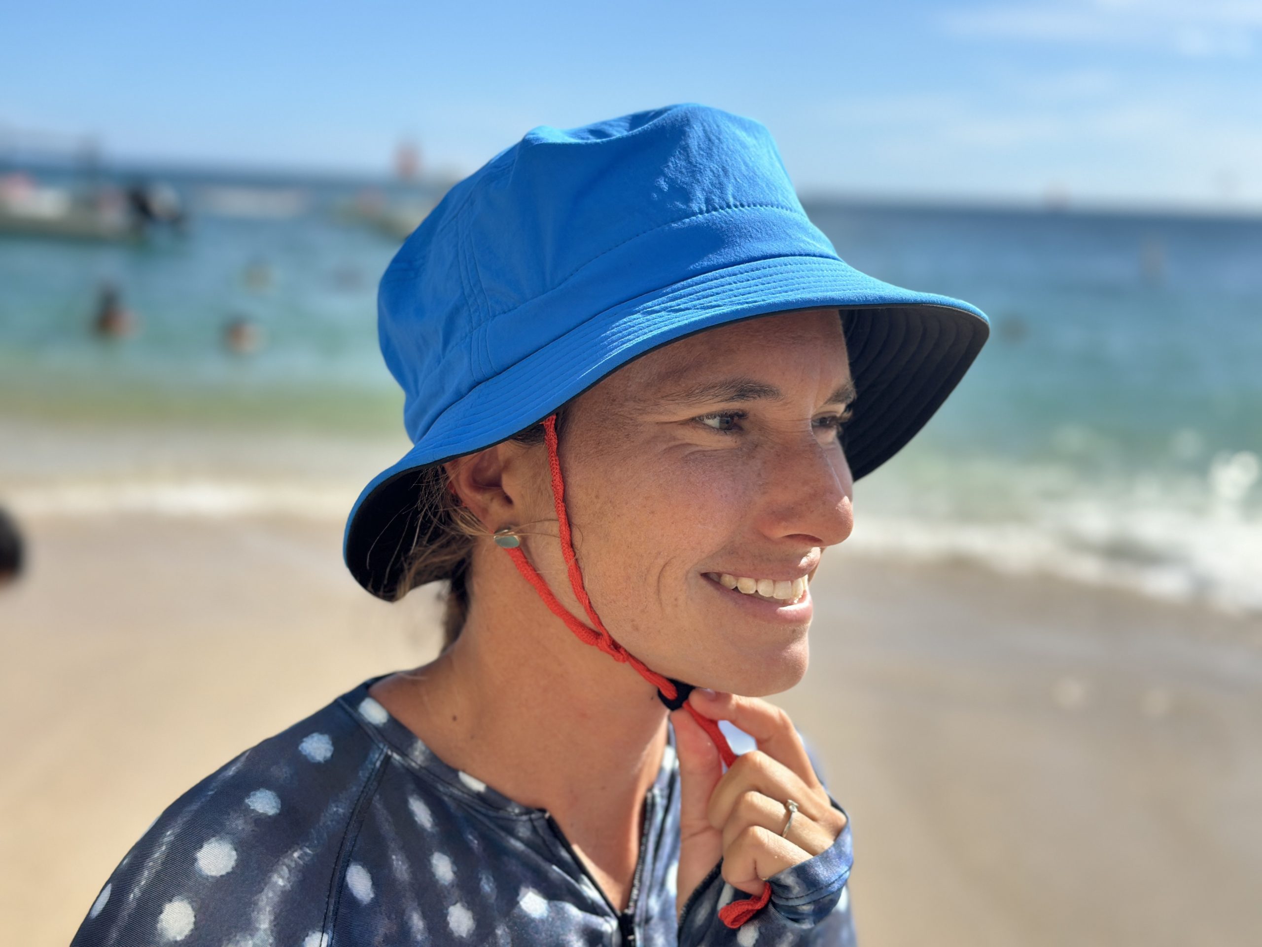 a woman wearing a patagonia surf hat