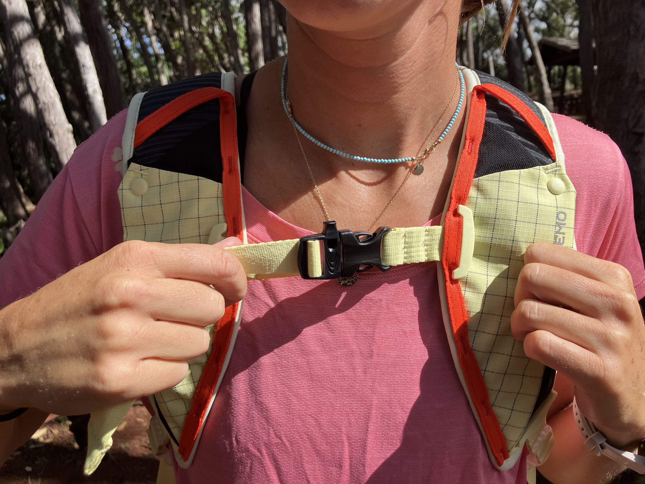 a close up of the sternum strap on a hiking backpack 