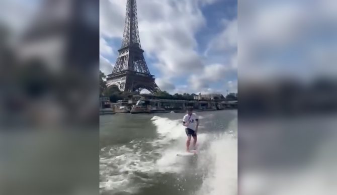 Kauli Vaast braves the famously polluted waters of the Seine to celebrate winning Olympic gold. Photo: Surfing France // Instagram