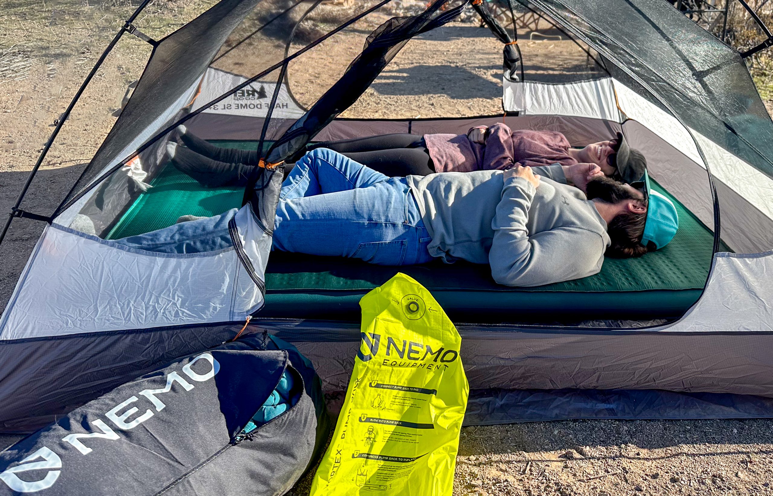 laying down on a plush camping sleeping pad