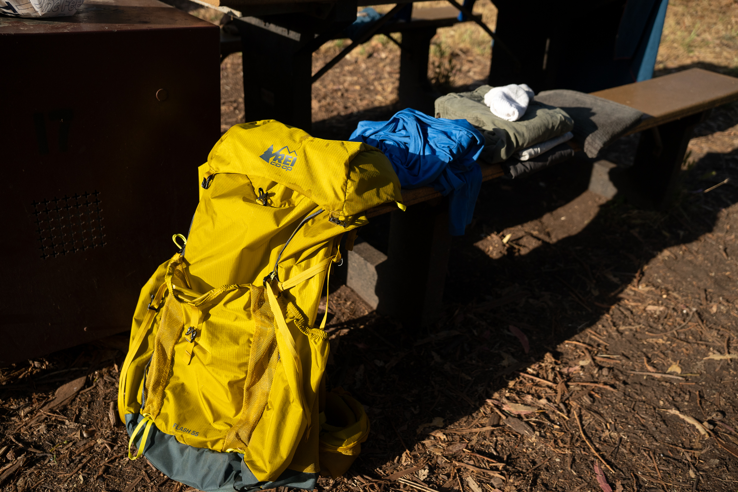 a backpacking backpack on a picnic table