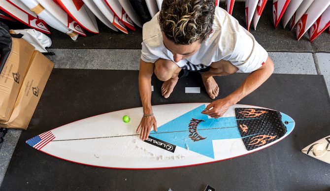 Griffin Colapinto adds a Lexus sticker to his board going into the 2024 WSL Finals. Photo: WSL