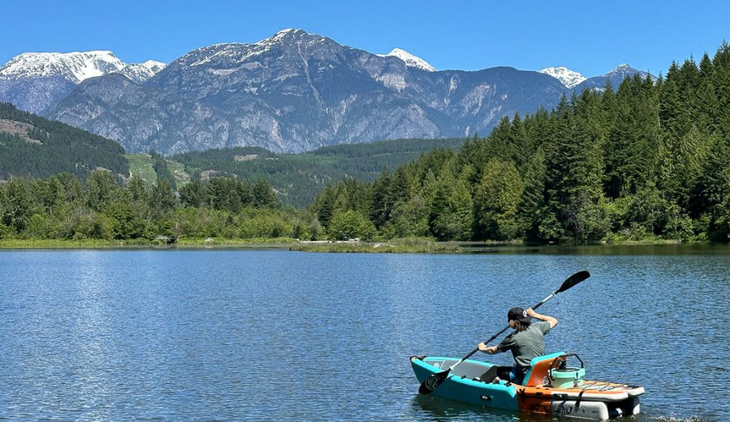 man kayaking with cooler