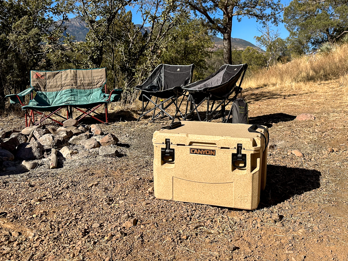 cooler next to camp chairs