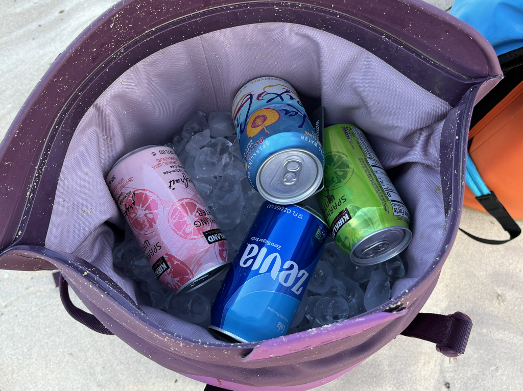 open cooler to show ice and drinks