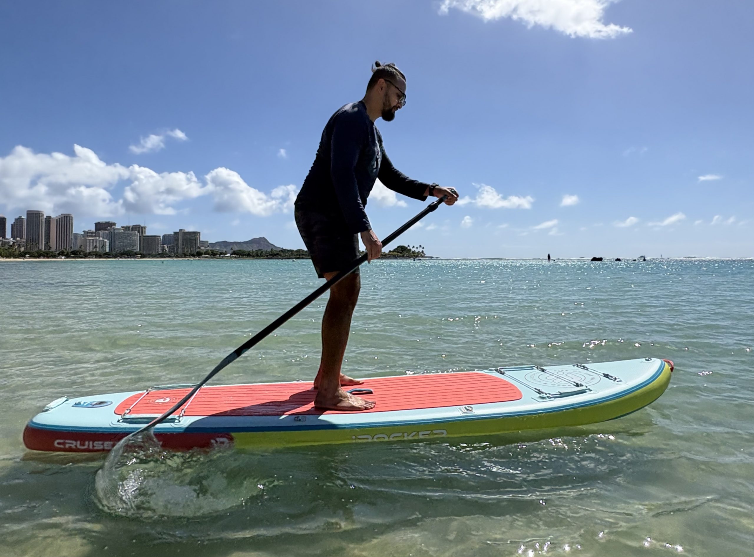 a man paddle boarding 