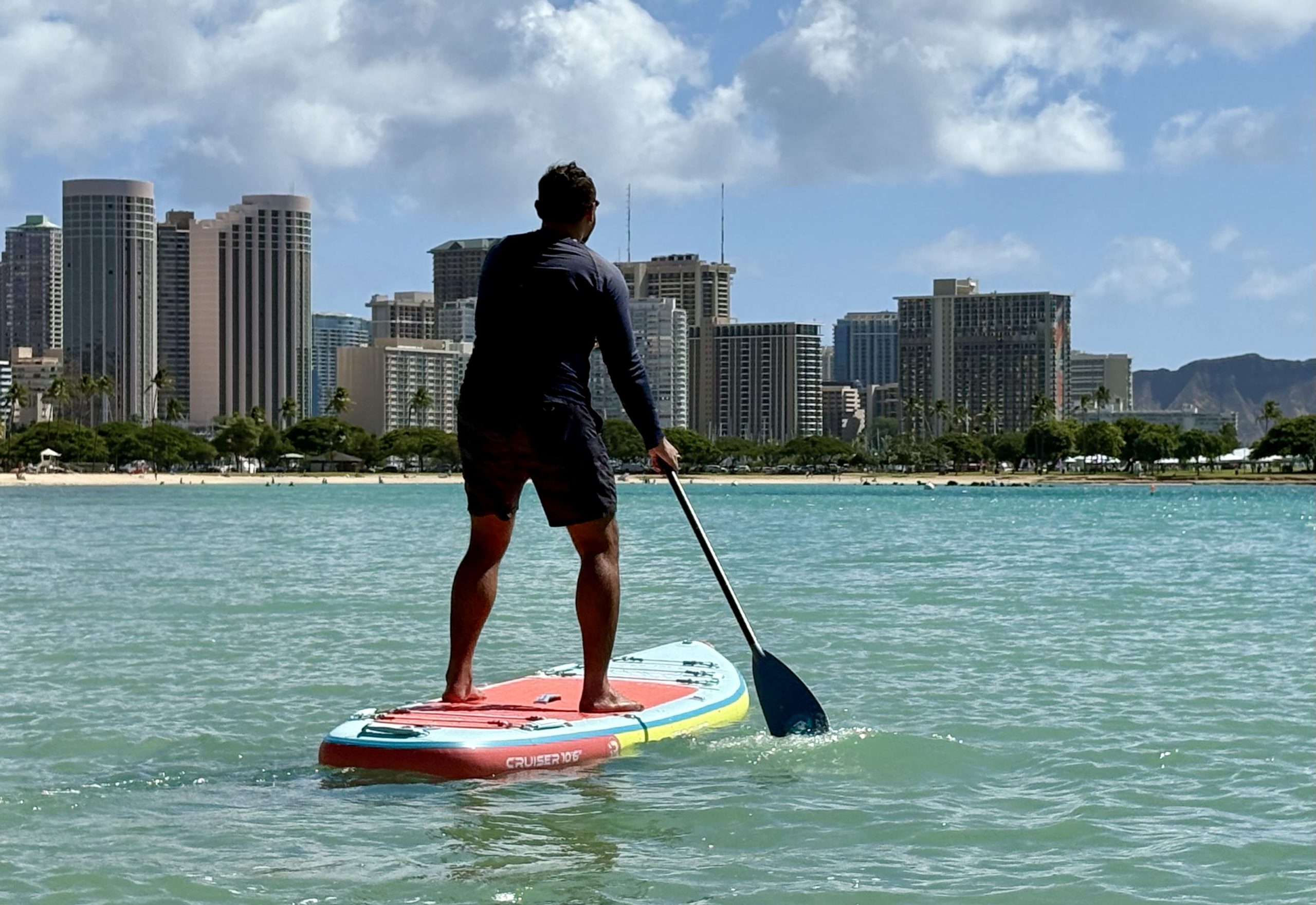 a man paddle boarding 