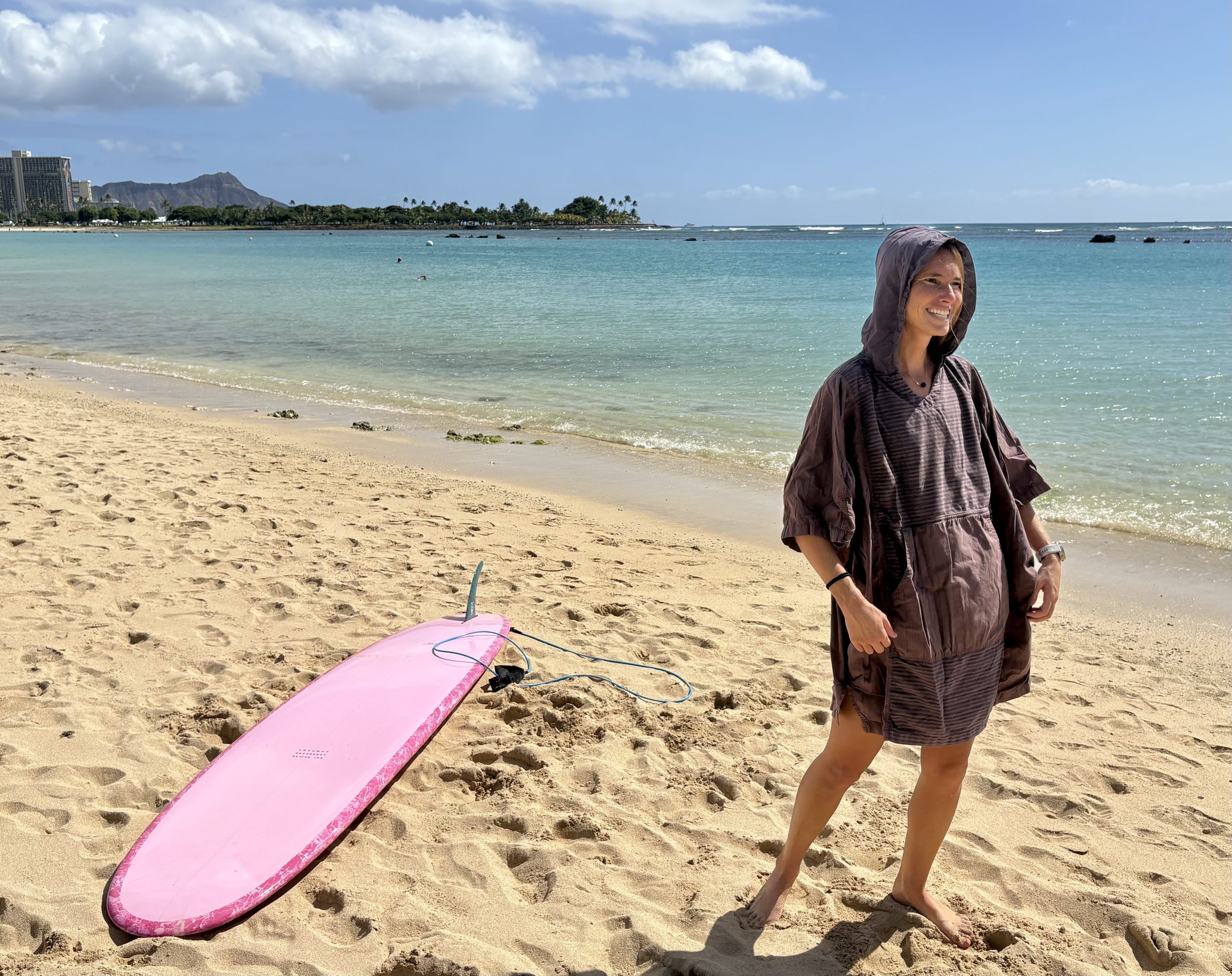 a woman in a surf poncho 