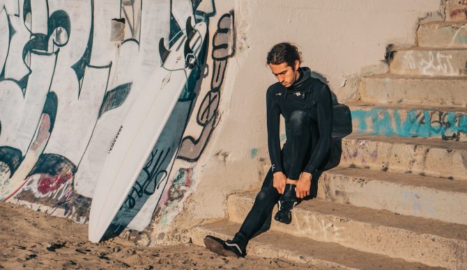 Will Sileo putting on a vans surf bootie at Ocean Beach San Francisco