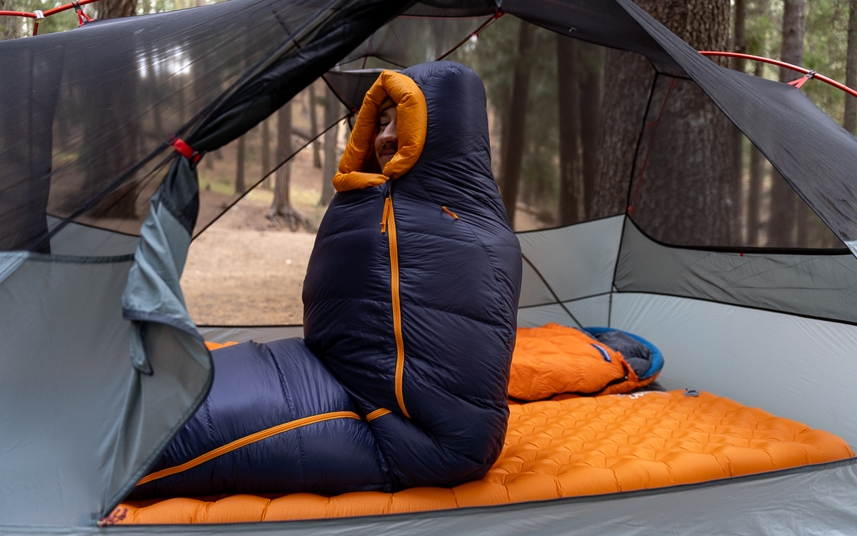 man sitting up in a backpacking sleeping bag